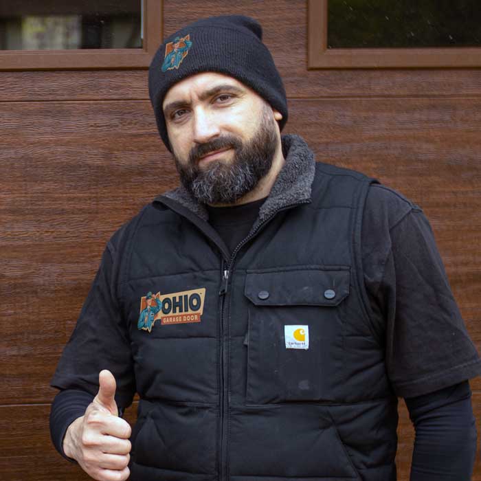 Garage Door Repair Technician Fixing Panel