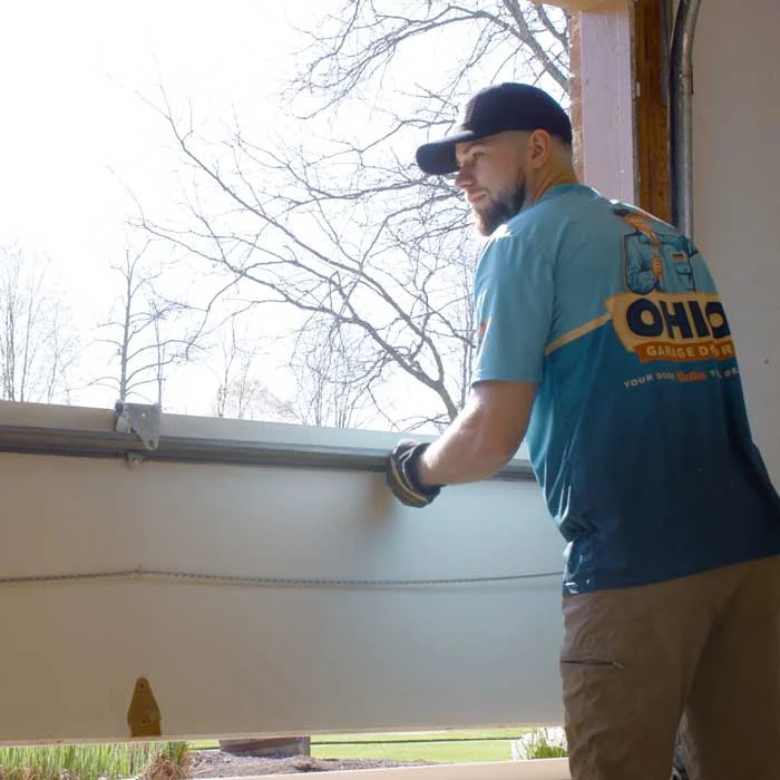 Ohio Garage Door Repair technicians are installing a new garage door near Mentor, OH