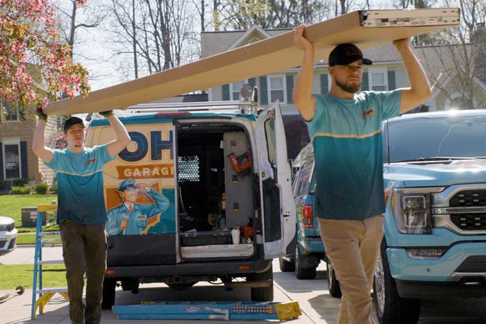 OHGDR Garage Door Repair technician installing a new overhead garage door