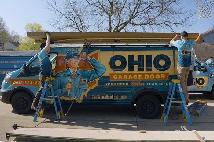 The Ohio Garage Door Repair technician unloading a work truck in Mentor